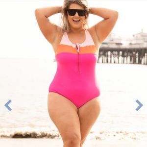 Plus Size pink and orange one-piece bathing suit. NWOT. Never been worn. Zipper.